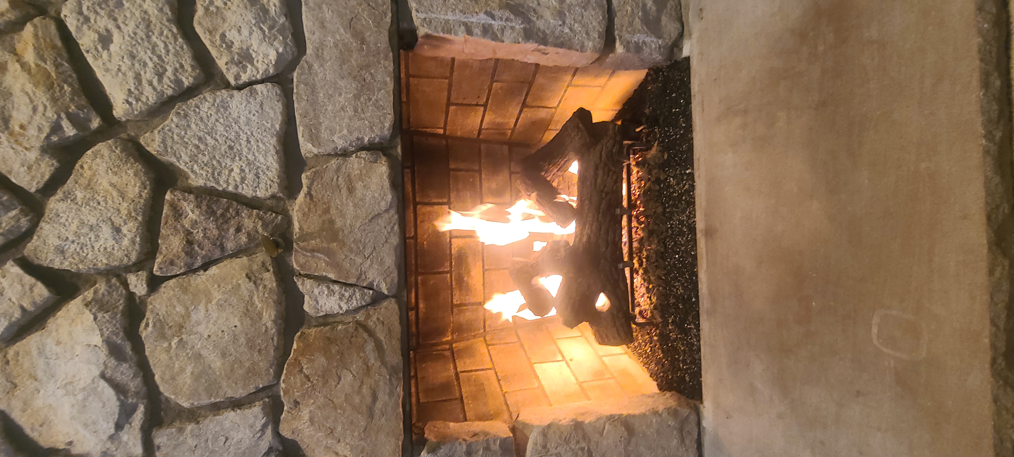 Wood burning fireplace with active flames